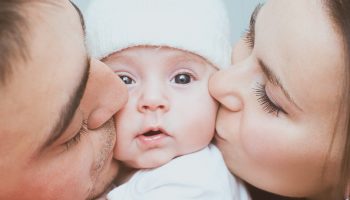 Young mother and father with newborn